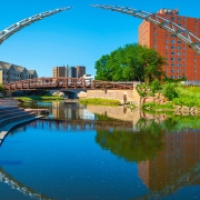 Summertime in Sioux Falls — downtown riverfront and Arc of Dreams sculpture at sunset