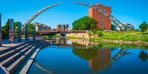 Summertime in Sioux Falls — downtown riverfront and Arc of Dreams sculpture at sunset