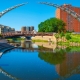 Summertime in Sioux Falls — downtown riverfront and Arc of Dreams sculpture at sunset